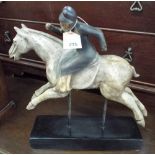 A rider on horseback figure ornament on black base