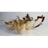 A three piece silver tea service, of panelled classical design, retailed by Mappin & Webb,