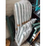 Two folding director style chairs, two folding sun loungers with mattress, a folding chair,