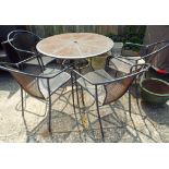 A circular black metal garden table with four matching elbow chairs All OK