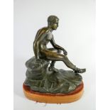 A bronze after the antique of Hermes seated on a raised wooden socle,