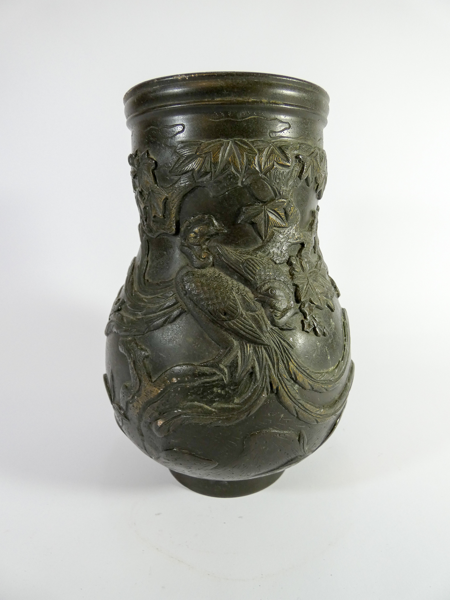 A Japanese bronze vase decorated with Cranes in relief,