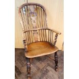 An elm stick back Windsor elbow chair with turned legs