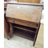 An oak students type bureau fitted one drawer and shelf under 2'6 wide