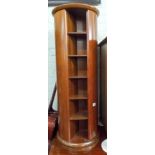 A mahogany revolving CD rack