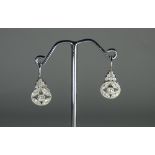 Art deco style platinum and diamond drop earrings set with brilliant cut diamonds with diamond