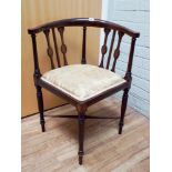 An Edwardian inlaid mahogany corner armchair