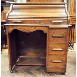 An early 20th Century oak S top, single pedestal roll top desk,