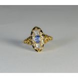 A 19th Century mourning ring set with a Ceylon sapphire to the centre with diamonds and black and