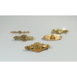 A group of five Victorian 9ct yellow gold bar brooches,