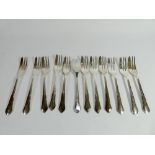A set of 12 Irish silver cake forks, 11.