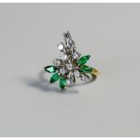 An 18ct yellow gold emerald and diamond cluster ring,