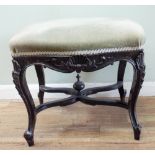 A Victorian dark walnut framed stool on cabriole legs with cross stretchers