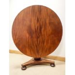 A Victorian circular mahogany snap over top breakfast or dining table on a pillar base with tripod