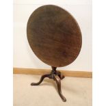 A Georgian circular mahogany snap top occasional table on pillar and tripod base,