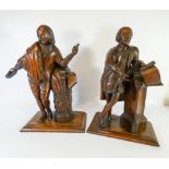 A pair of antique carved mulberry figurines of Shakespeare.