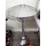 A stainless steel finish table top patio heater