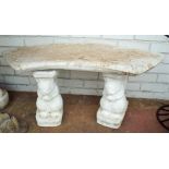 A curved shape reconstituted stone two seater garden bench with squirrel base