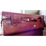 A Crocodile skin style suitcase