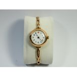 ladies vintage rose gold wristwatch with flexible strap, engraved on reverse and dated 1919,