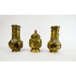 A small garniture of Japanese polished bronze vases and jar and cover,