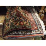 Two Iranian figured wool pile rugs and an Axminster carpet runner