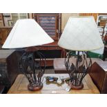 A pair of decorative metal table lamps with shades