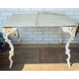 A white painted cast iron table with marble top