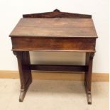 A church style heavy oak desk with lift up lid and fielded side panels, 31.