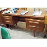 A G-plan teak knee hole dressing table with pull out centre slide and drawers,