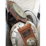 A quantity of old clock parts and dials etc