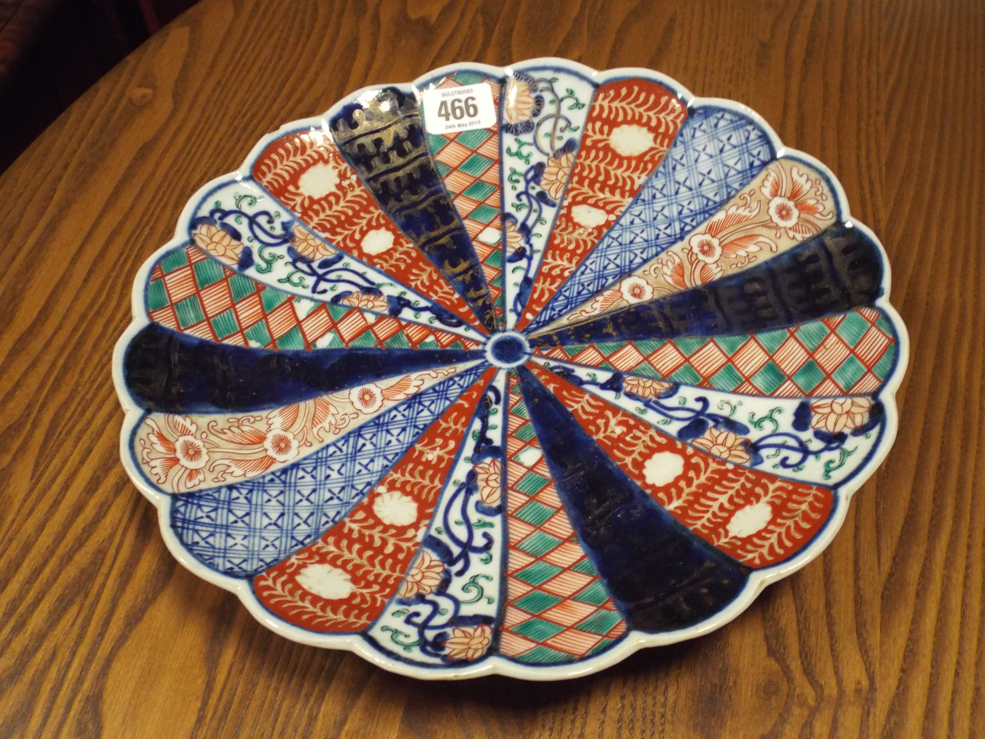 An Imari charger plate with lobed edge,