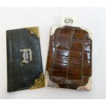 A silver mounted brown leather crocodile effect wallet and a leather aide-memoire with gilt metal