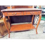 A mahogany two tier hall table fitted two drawers on cabriole style legs 3' wide and a cane