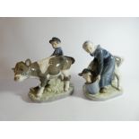 Royal Copenhagen figure of a boy with calf No. 772 and a girl feeding a calf number No.