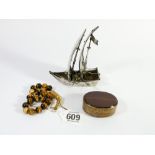 Dutch silver miniature Neff or sailing boat together with Tigers Eye prayer beads and an agate
