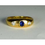 18ct yellow gold three stone gypsy style sapphire and diamond ring, 4.9 grams gross weight.