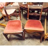 A set of four Georgian mahogany dining chairs with bar back and red upholstered seats