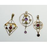 Three Edwardian art nouveau design pendants,