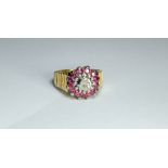 18ct gold ruby and diamond cluster ring, gross weight 7.