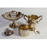 A small silver trophy cup, a silver sovereign case (a/f) and a silver napkin ring,