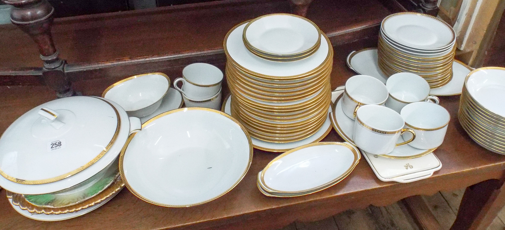 Limoges gilt boarded dinner and tea set with three odd plates