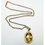 Oval citrine pendant on a 9ct rose gold belcher link chain, gross weight 12.