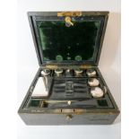 An Edwardian leather travelling case by Mappin & Webb & Co with silver plated fittings