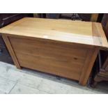 A heavy light oak blanket chest,