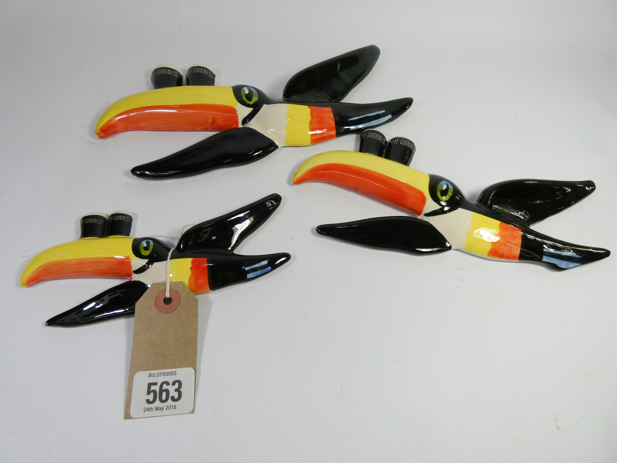 A set of thee Carlton ware flying toucan Guinness wall plaques