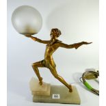 A 1930's Art Deco lamp of a dancing lady holding a frosted globe standing on a onyx base,
