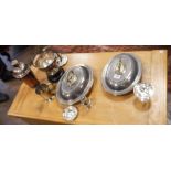 A pair of oval silver plated entree dishes with covers, toast rack, cocktail shaker,