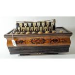 A small inlaid accordion by J Gregory of Nottingham, decorated bellows,