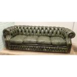 A Victorian style four seater Chesterfield settee in buttoned green leather